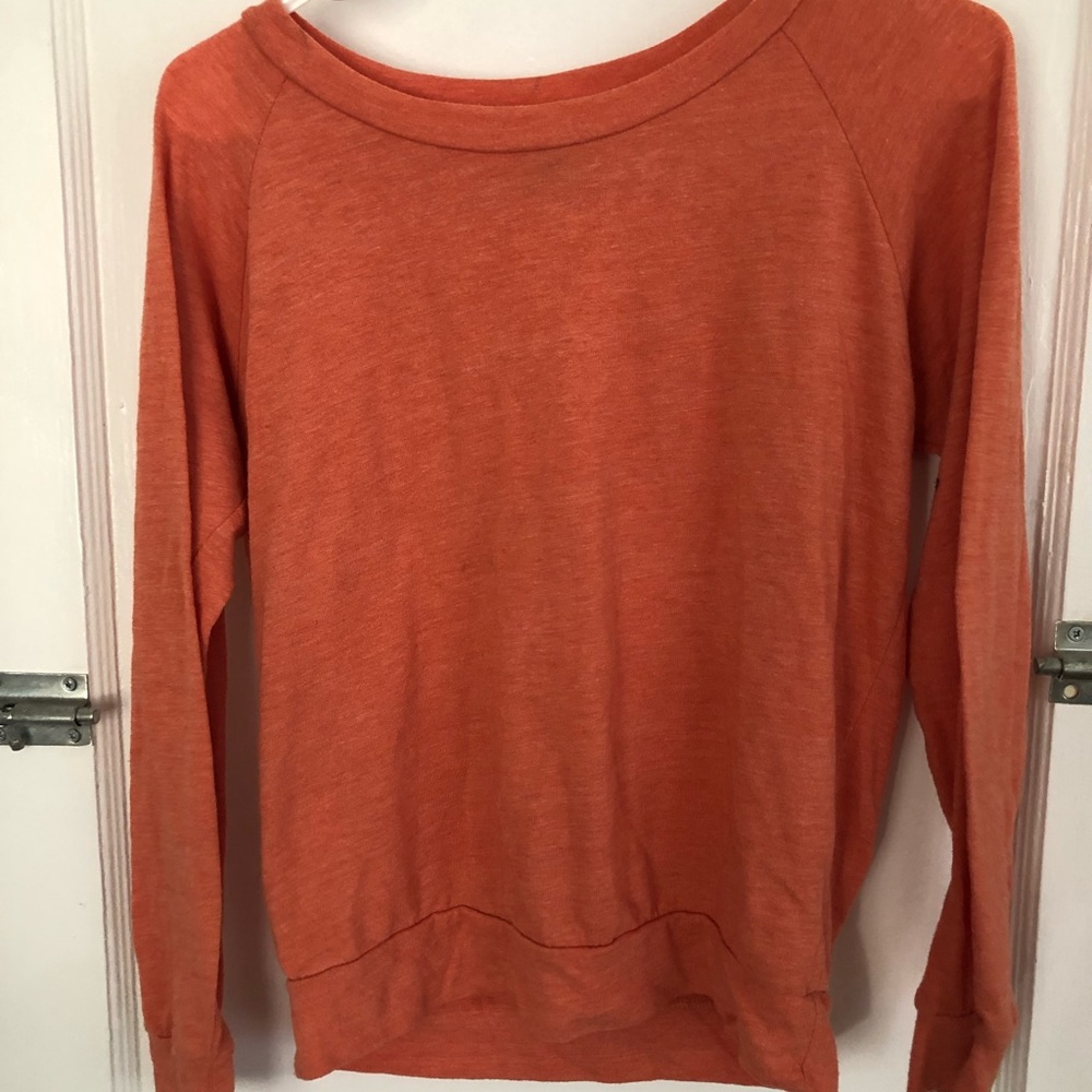 Small, orange, long sleeve shirt